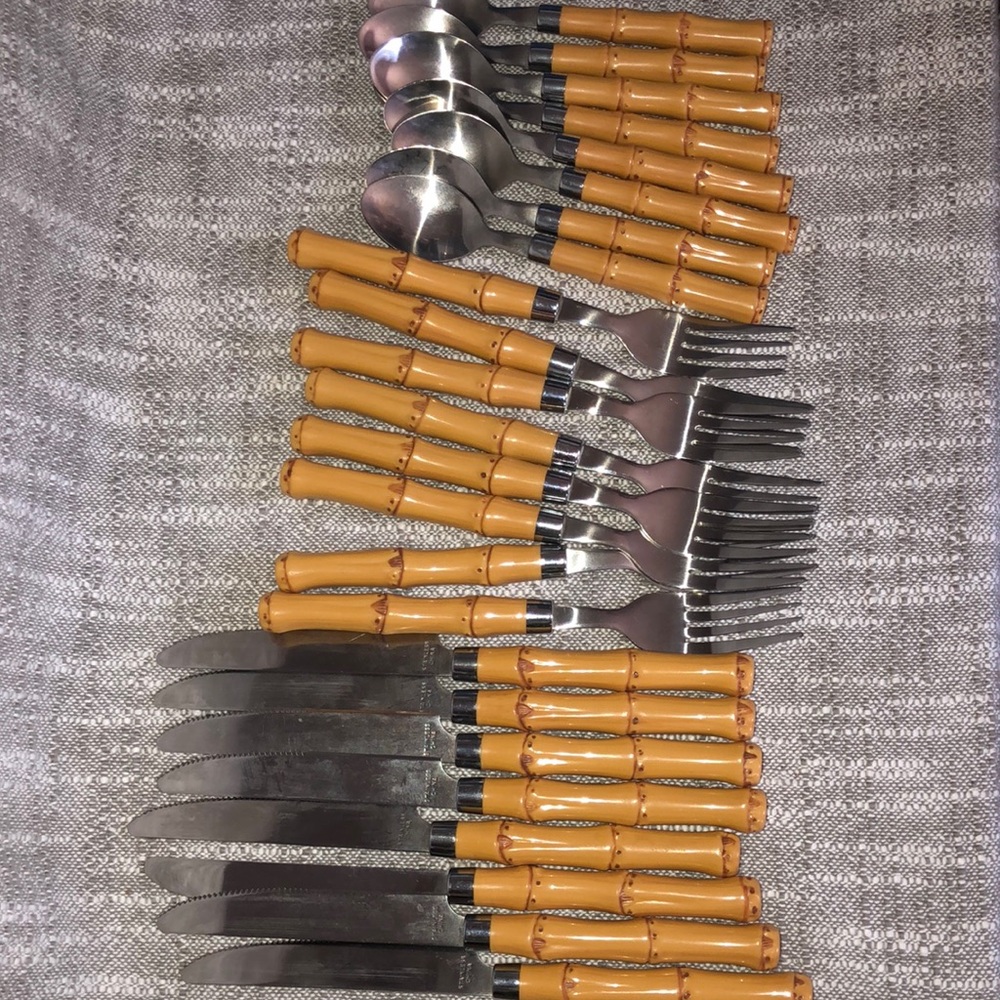 Stainless steel knives forks and spoons. Plastic bamboo handle.